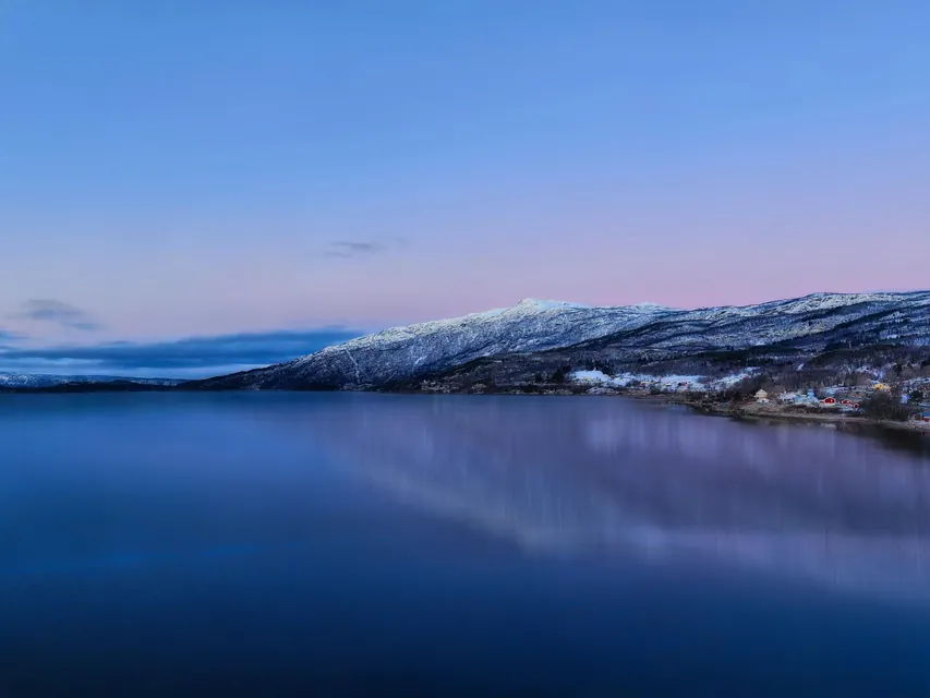 Body of Water Under Blue Sky