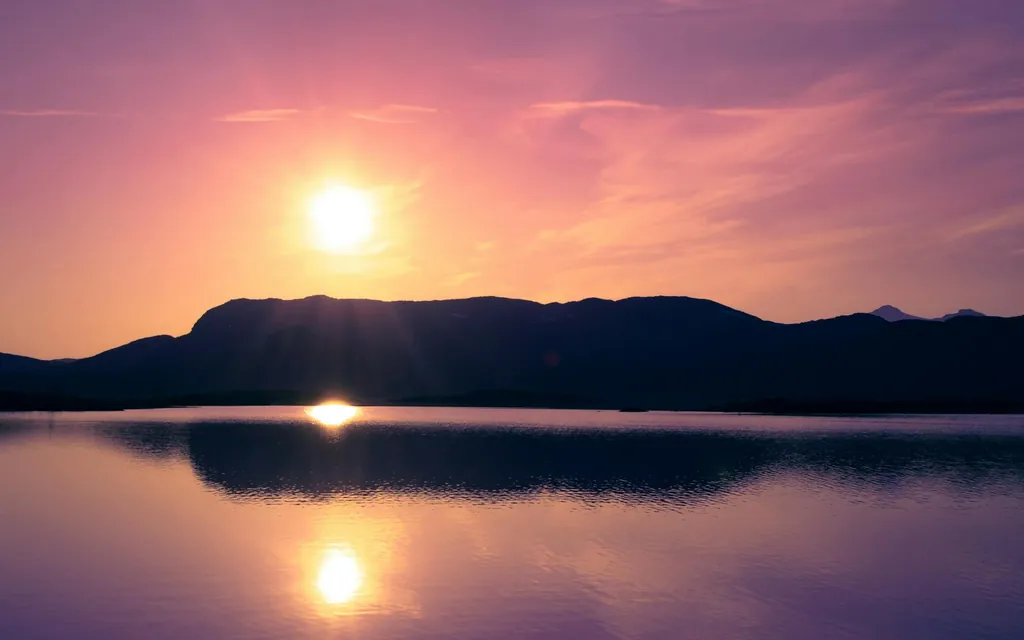 Dramatic sunset above a lake, Björkliden, Norrbotten County, Sweden
