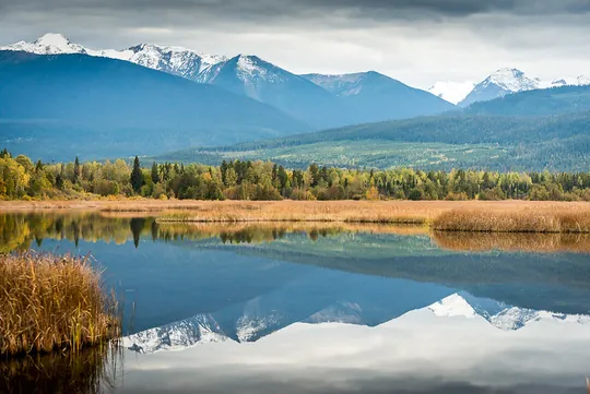 Reflected mountains at Cranberry Marsh near Valemount, British Columbia, Canada