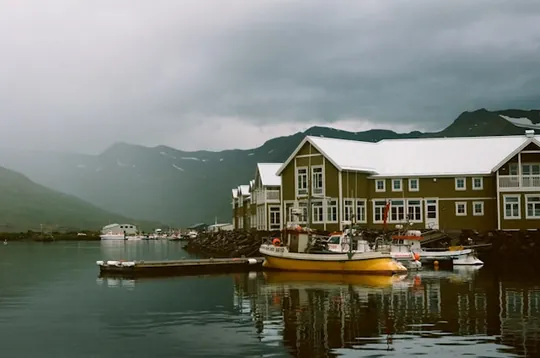 A view of Siglufjörður, Iceland with colourful buildings along the waterfront