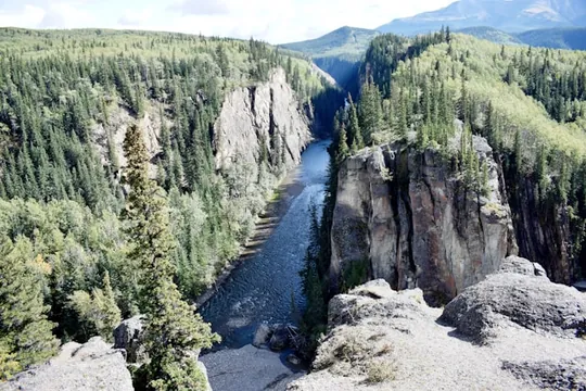 Scenic view of a river cutting through a rocky valley near Grande Cache, Canada