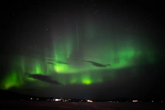 The Northern Lights over the village of Kurravaara in Swedish Lapland