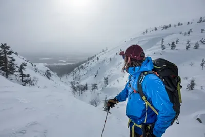 View down a snowy valley while skiing near Pyhä, Finland